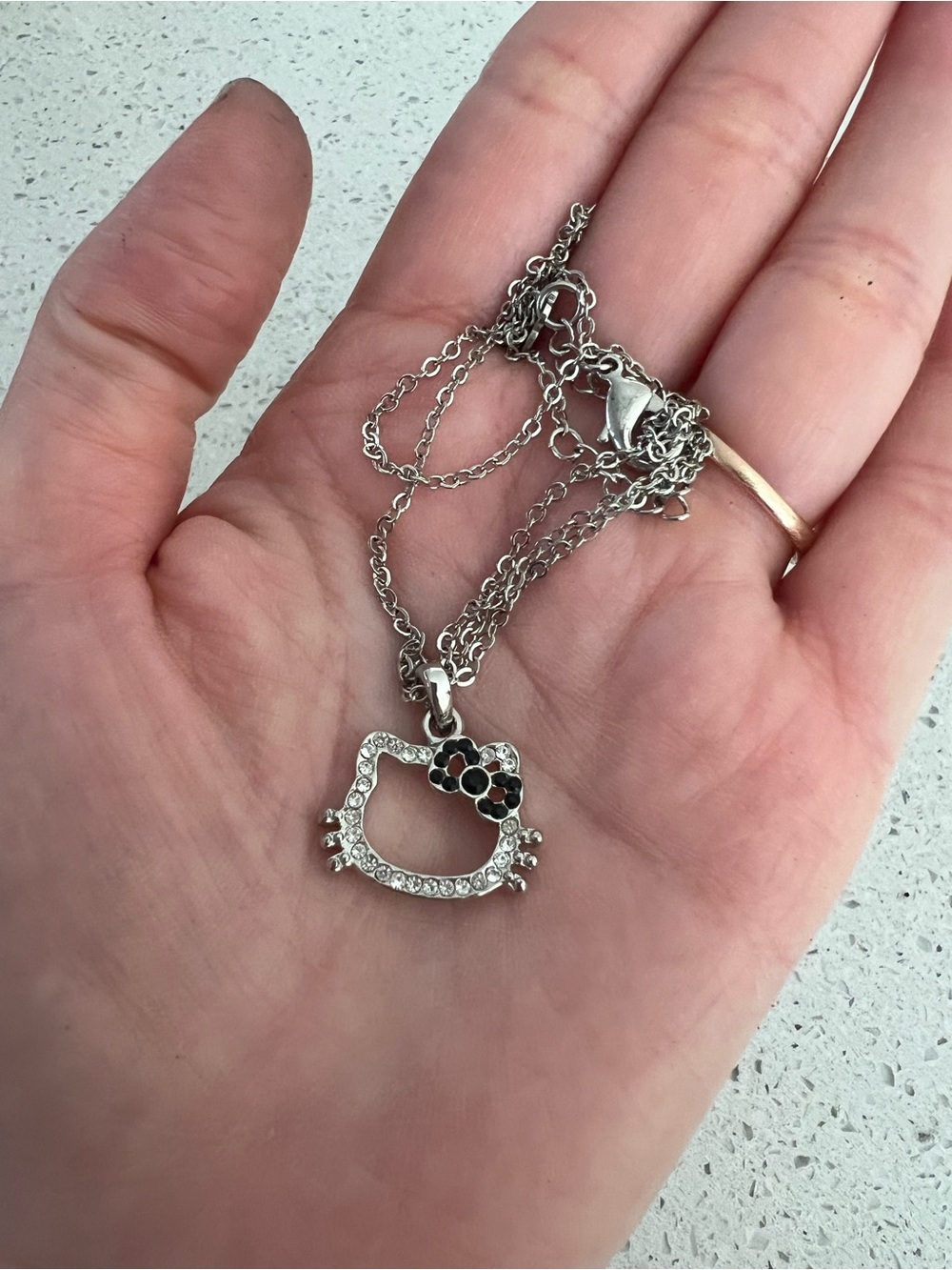 Hello Kitty Silver Tone Crystal Pendant Necklace - Silver with Black Bow